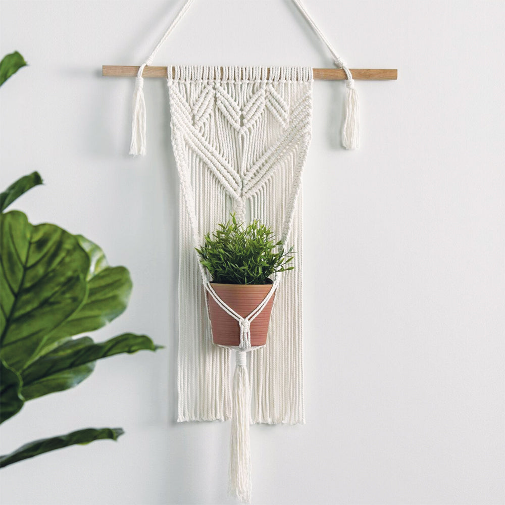 hanging a macrame plant hanger Free Macramé Wall Hanging Planter Pattern – Mary Maxim Ltd