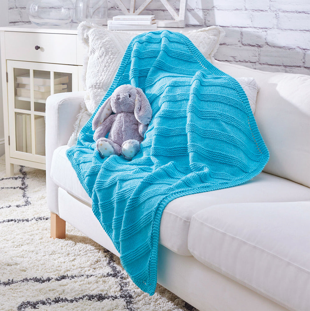 Modèle gratuit de couverture pour bébé en tricot câlin